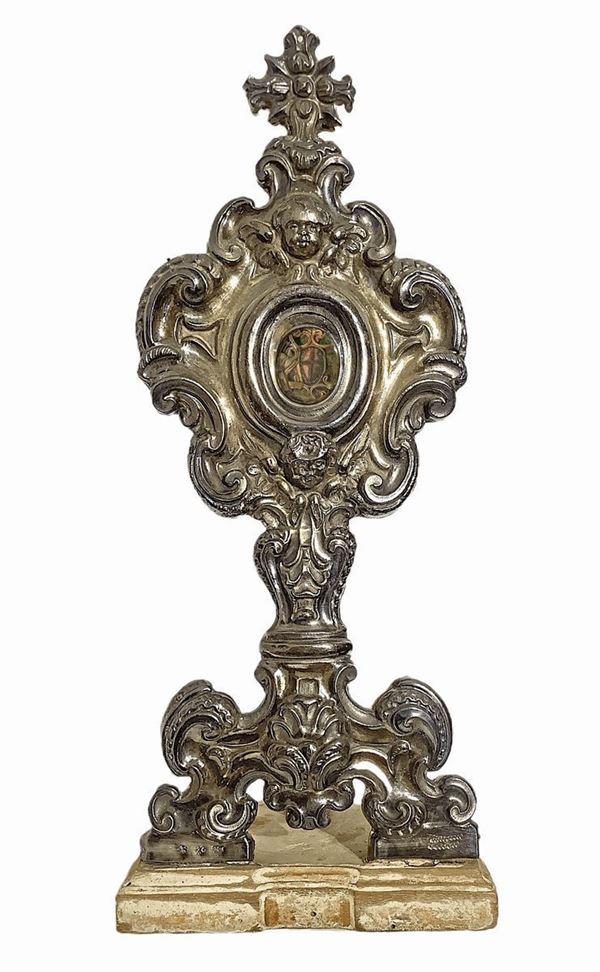 Reliquary in silver, eighteenth century on a wooden base. Dated on the base 1793. Initial F.M. H 37 cm