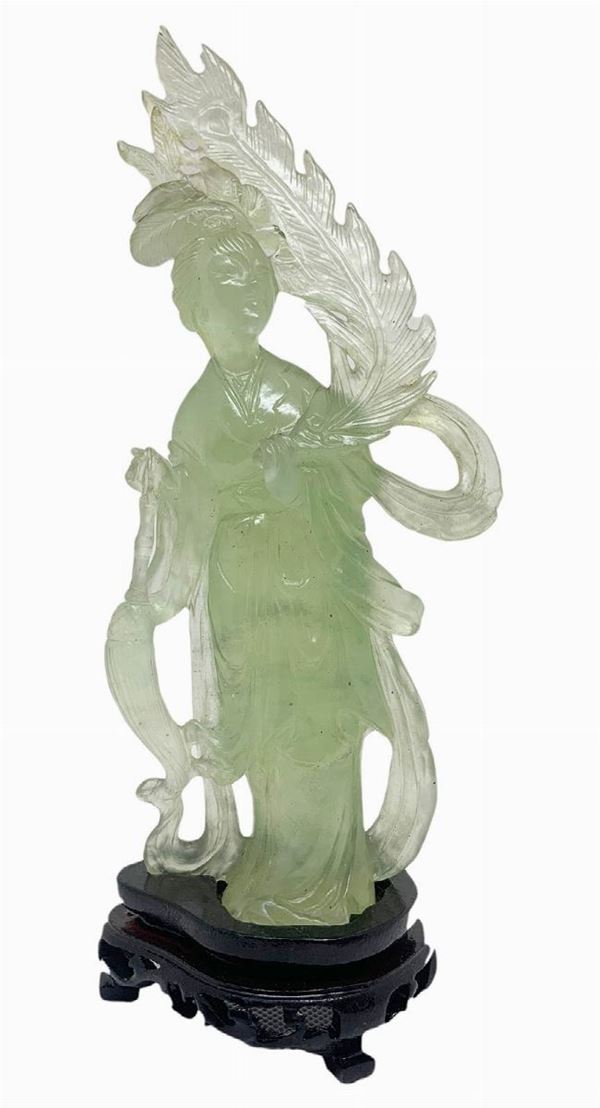 Statuette jade light green depicting Guanine. Provenance Beijing Early years of the '900. H 20. H cm with base 22.5 cm. Width 6 cm.
