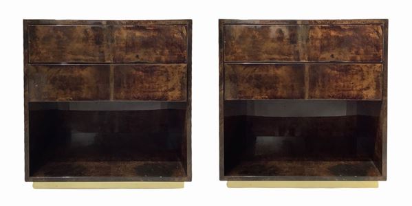 Prod.Aldo Tura, Pair of tables with wooden structure, coating acrilicata parchment in shades of brown and drawers with pressure opening. Signs of use