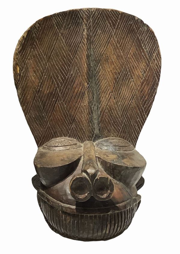 Bamileke Batcham, Mask, Cameroon, early twentieth century. H 82 cm width 40 cm.