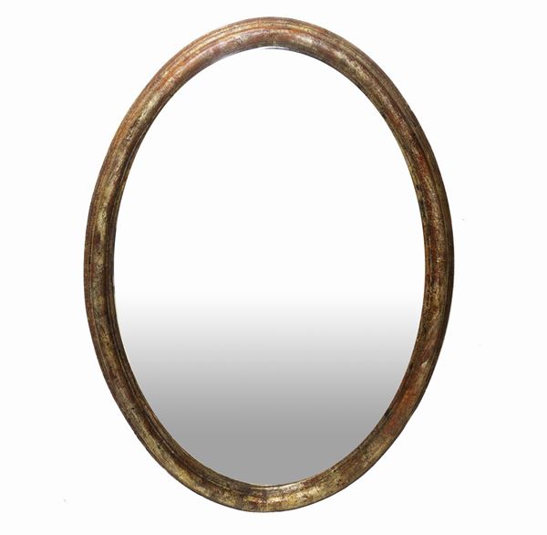 Specchiera ovale con cornice dorata
