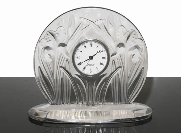 Lalique France - Crystal table clock with bas-relief plant decoration.