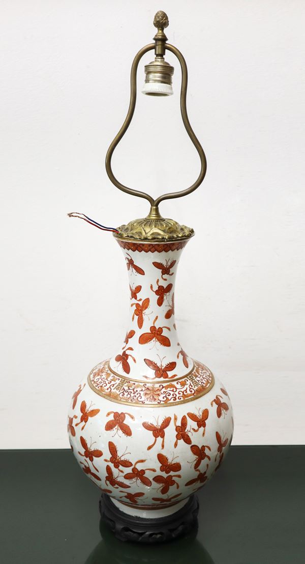 Chinese lamp in shades of white, gold and red with butterflies