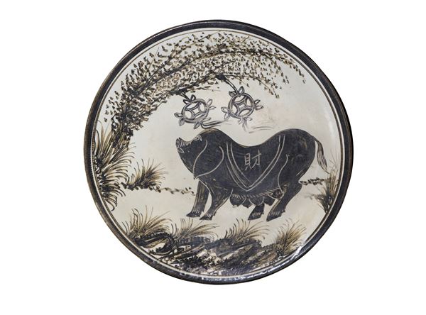 Porcelain plate depicting a pig