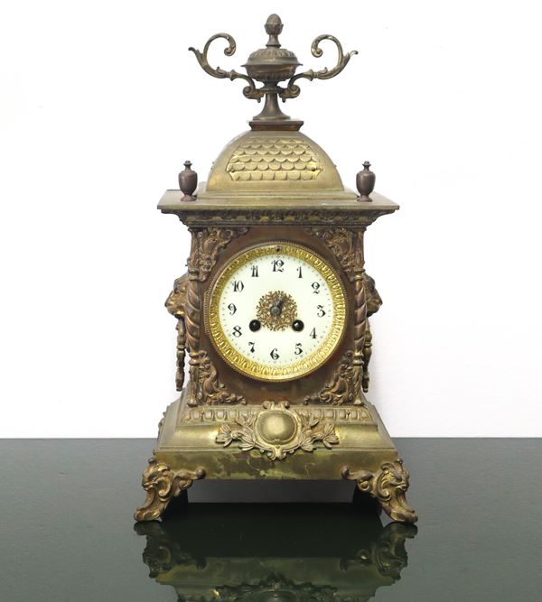 Pendulum table clock. In gilt metal with porcelain dial