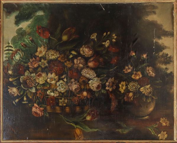 Composizione di fiori in cesto e in vaso