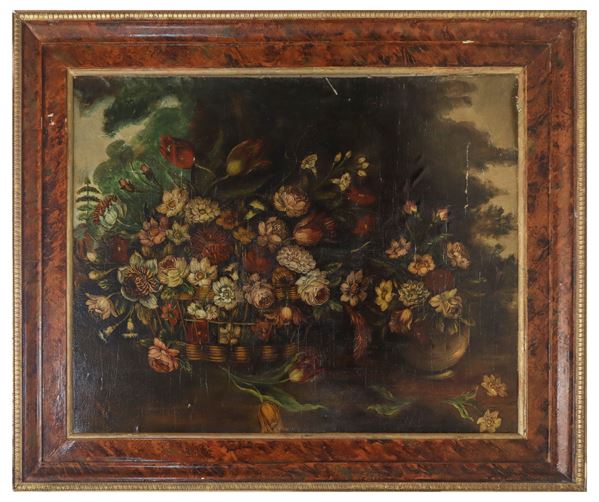 Composizione di fiori in cesto e in vaso