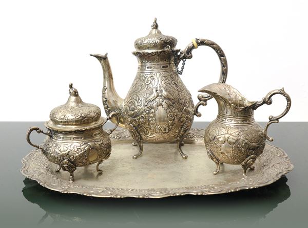Hand-embossed silver service