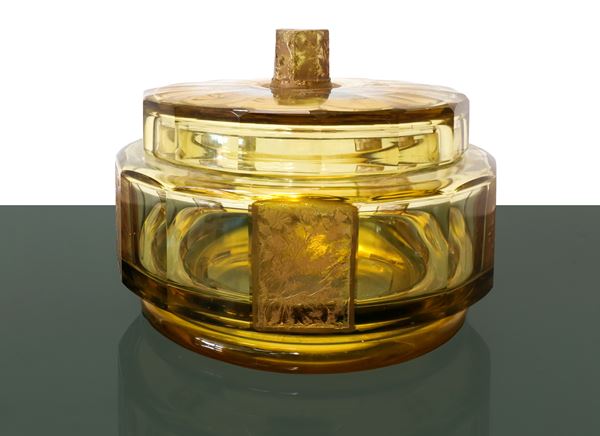 Crystal cookie jar in yellow and golden tones