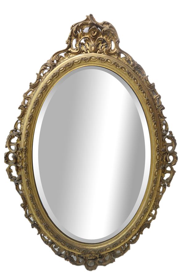 Specchiera ovale in legno dorato