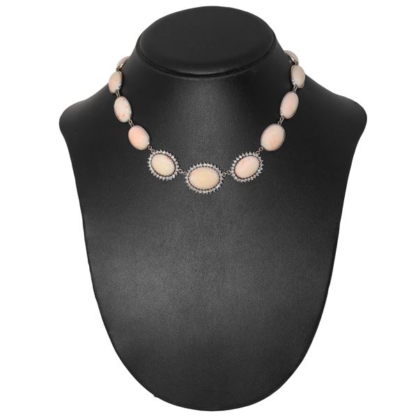 White gold necklace with 13 pink coral ovals