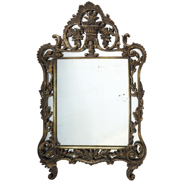 Mirror in carved frame with floral motifs