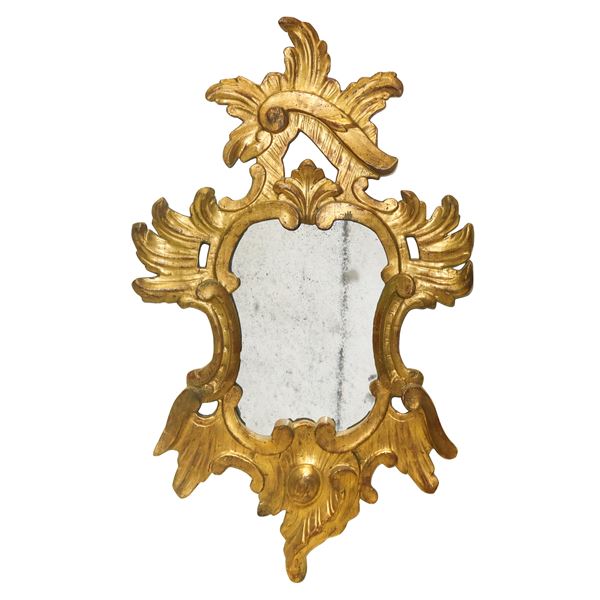 Mirror in gilded and inlaid wood