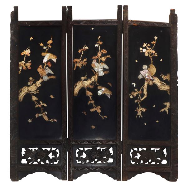 Low Chinese wooden divider with mother-of-pearl inserts and light woods.