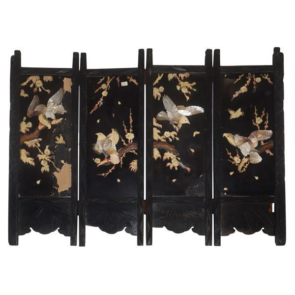 Low Chinese wooden divider with mother-of-pearl inserts and light woods.