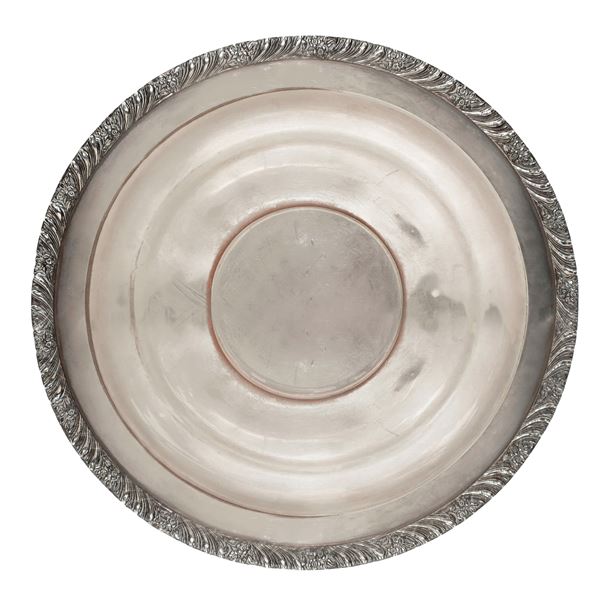 Silver centerpiece plate, double layer edge decorated with floral motifs
