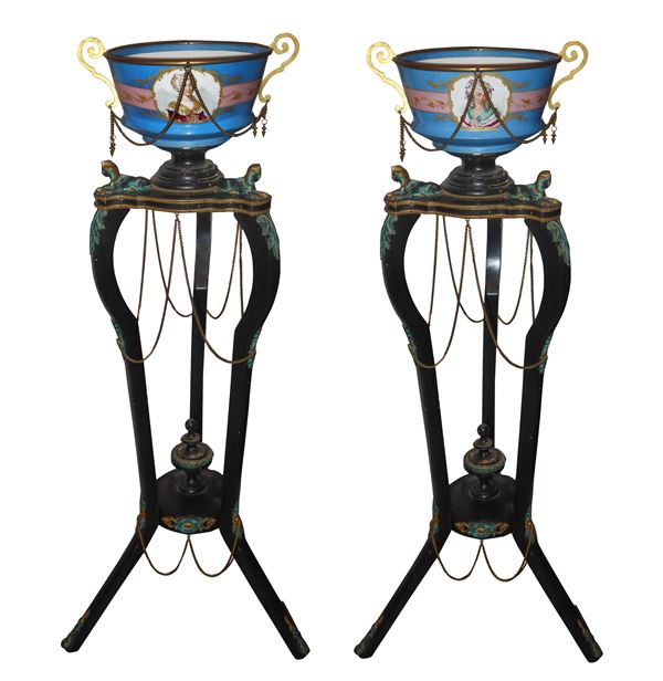 Pair of black ebonized wooden corner pieces with bronze applications