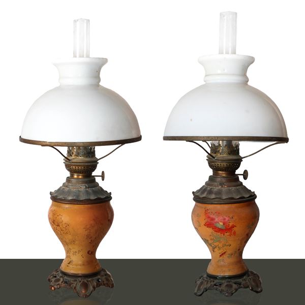 Pair of oil lamps with floral designs