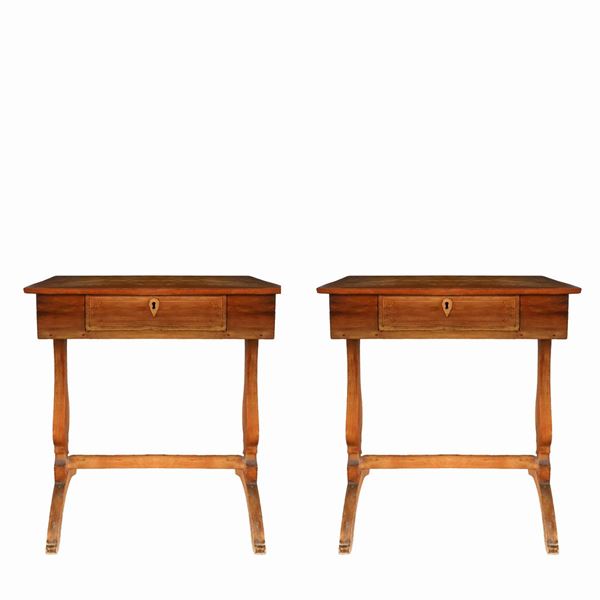 Pair of wooden tables with a star inlaid in the center of the top.