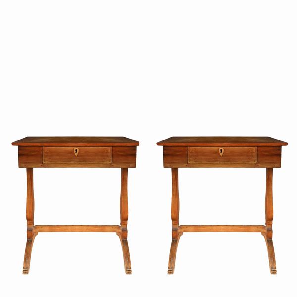 Pair of wooden tables with inlaid star in the center of the top.