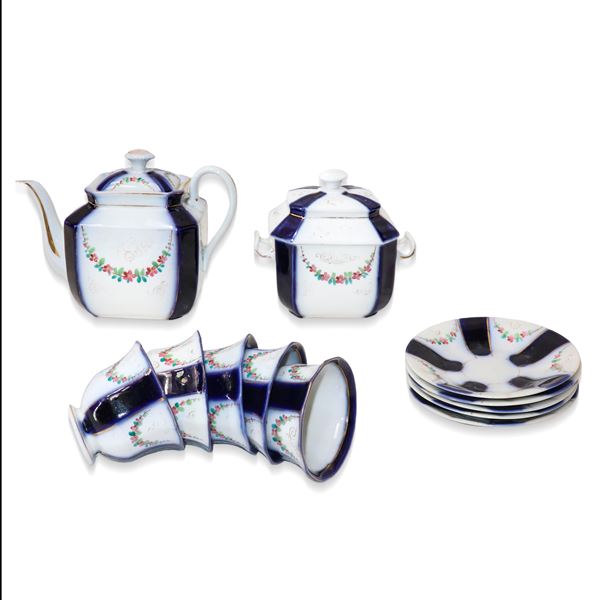 Blue and white porcelain tea service with polychrome flower garlands.