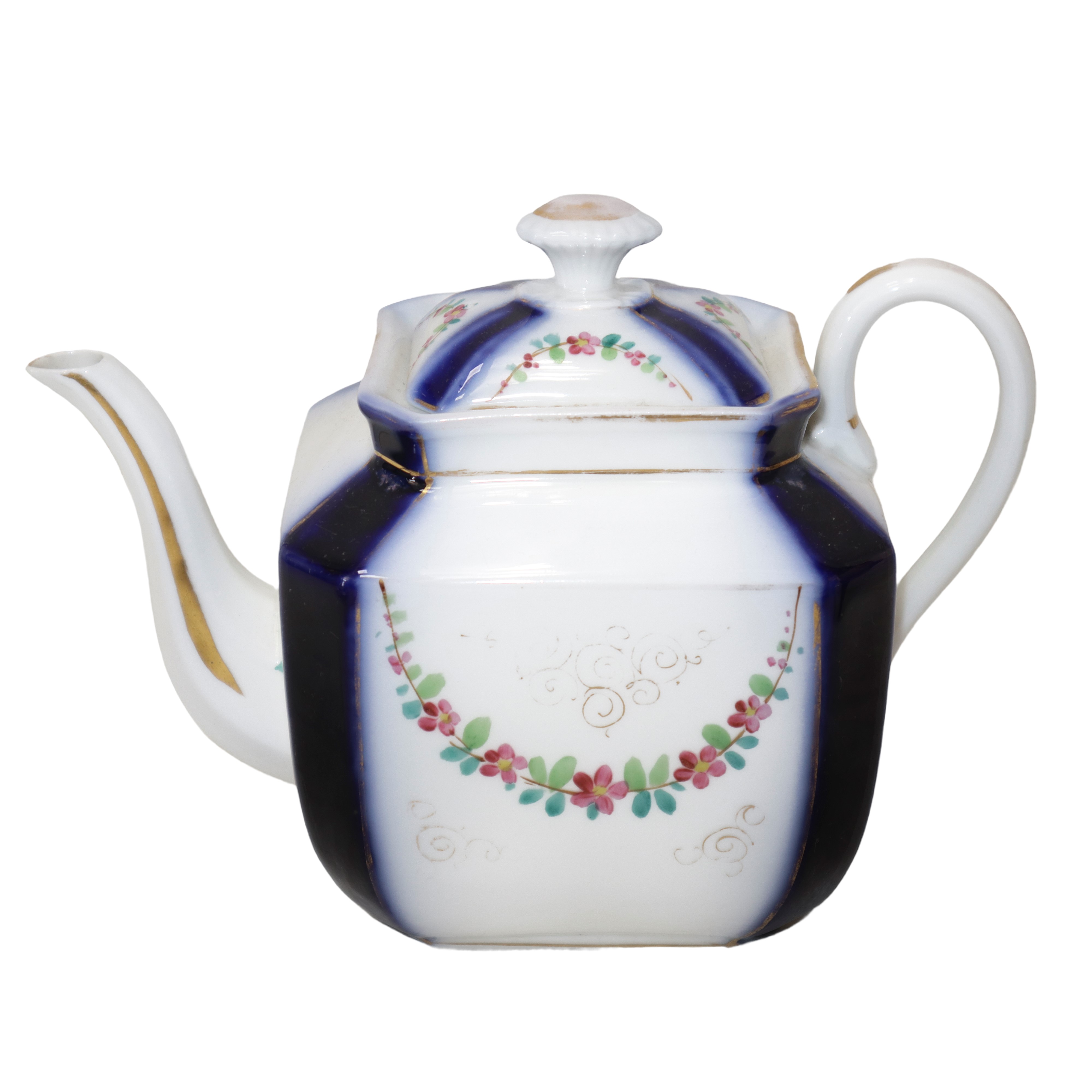 Servizio da tè in porcellana bianca e blu con ghirlande a fiori policromi.