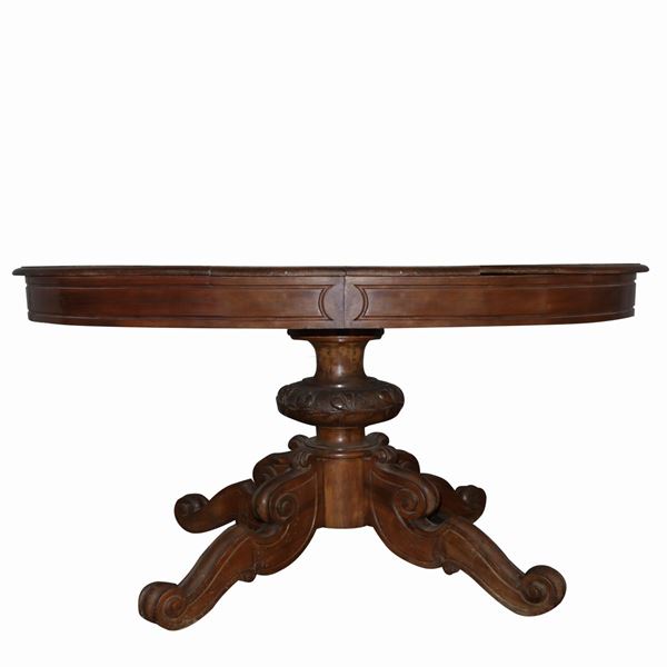 Extendable oval table in walnut wood