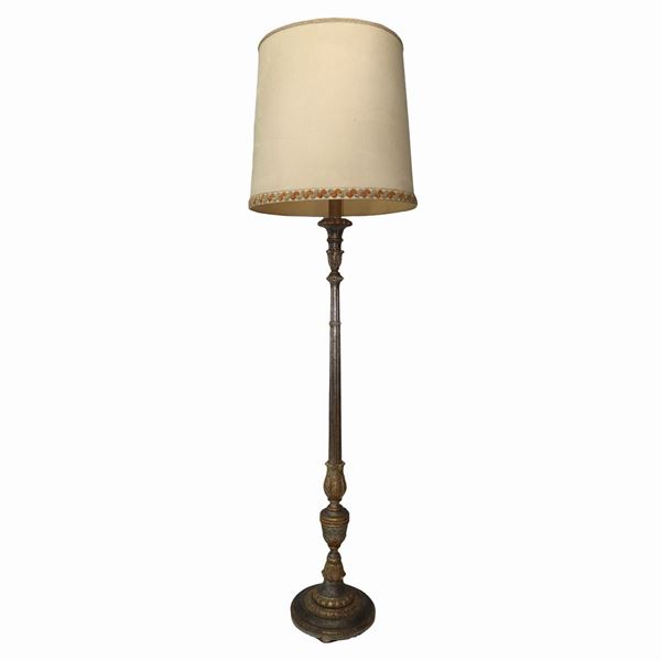 Standing candlestick in gilded and silvered wood