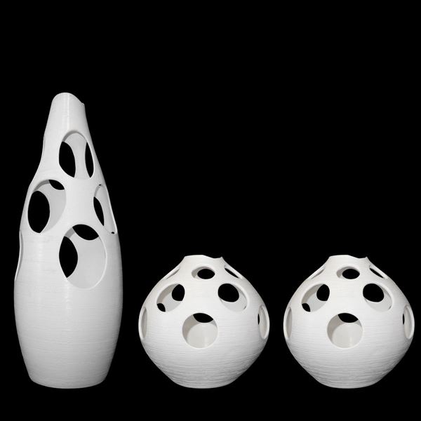 Group composed of n. 3 opaque white perforated ceramic vases, mod. Sheila