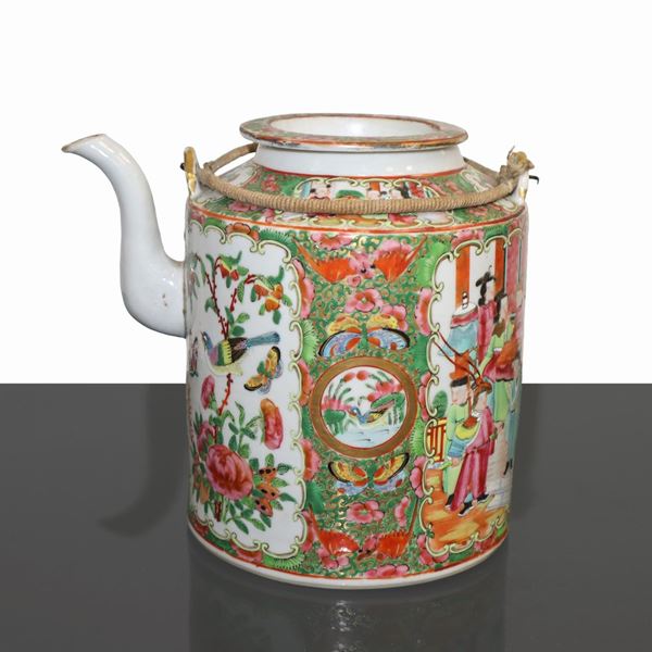Chinese teapot decorated with flowers, birds and characters.