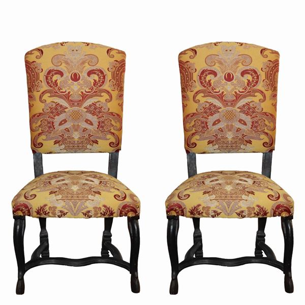 Pair of Louis XIV baroque chairs, upholstered in damask in shades of burgundy and yellow.
