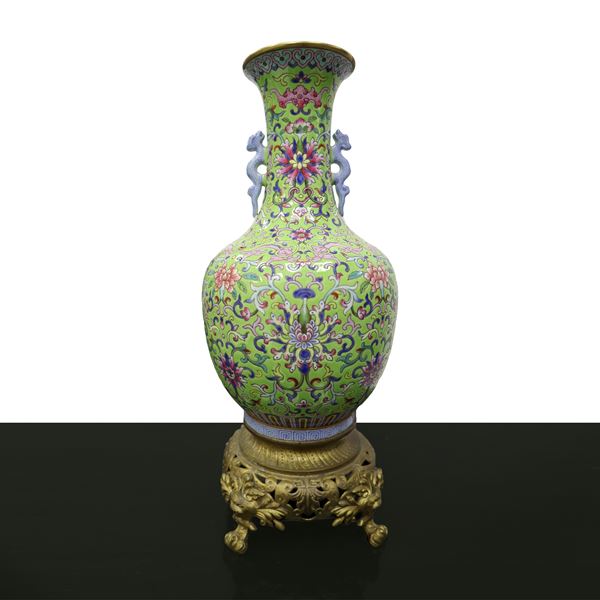 Vase with green background and flower design