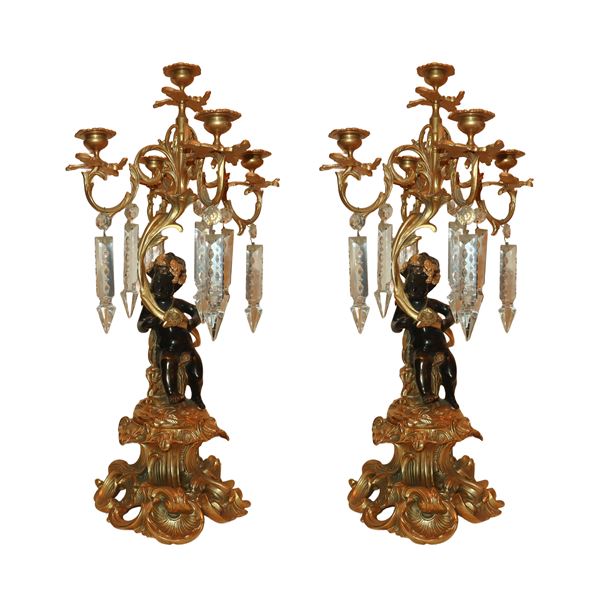 Pair of 5-light candelabra with black patinated cherubs in support, ground glass brindoli.