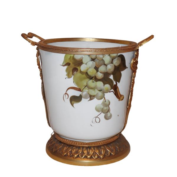 Porcelain vase with golden metal handles and base