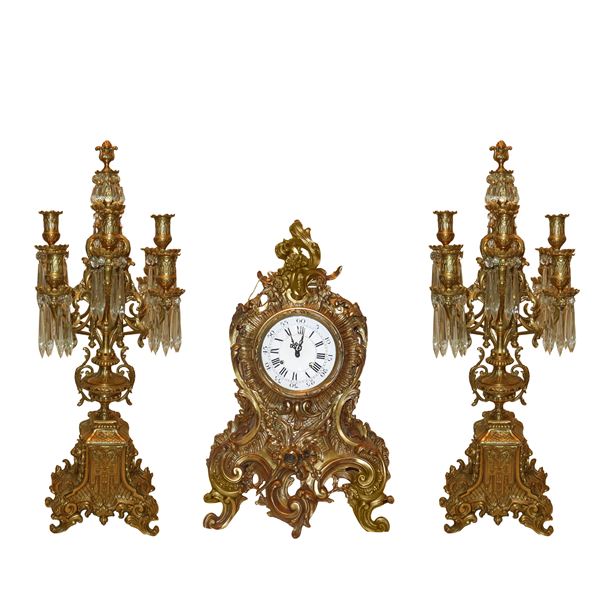Baroque triptych consisting of a table clock and two 8-light candelabra