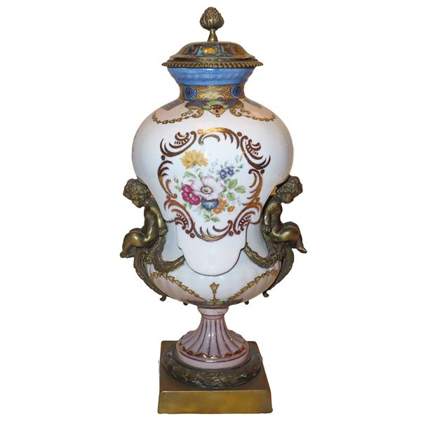 Poutiche vase in decorated and painted white porcelain, gilded bronze putti applied to the sides