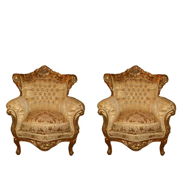 Pair of Baroque style armchairs in gilded wood