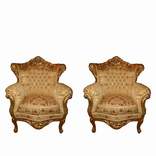 Pair of Baroque style armchairs in gilded wood