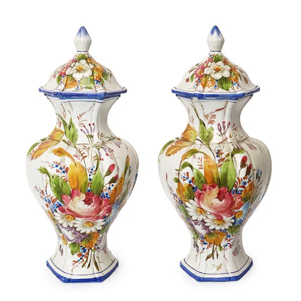 Pair of white ceramic potiche with floral decorations