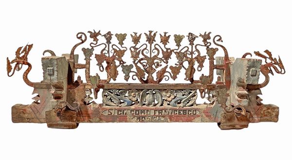 Fragment of handcart, molten wing. In polychrome wood carved cherubs, gargoyles and wrought iron at the forge in the Baroque style with paladins heads with helmet and eagles, Author Francesco Di Giacomo, Modica, Catania, Sicily late nineteenth century, early twentieth century. H Cm 40x100