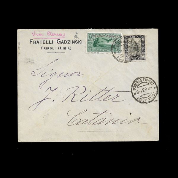 Busta spedita per posta aerea da Tripoli a Catania l'8/6/1931 e arrivata a destinazione lo stesso giorno (targhetta al verso). Affrancatura composta dal 50 c. Libia Pittorica (n.28) e dal gemello di posta aerea Virgilio di Tripolitania (n.A4).