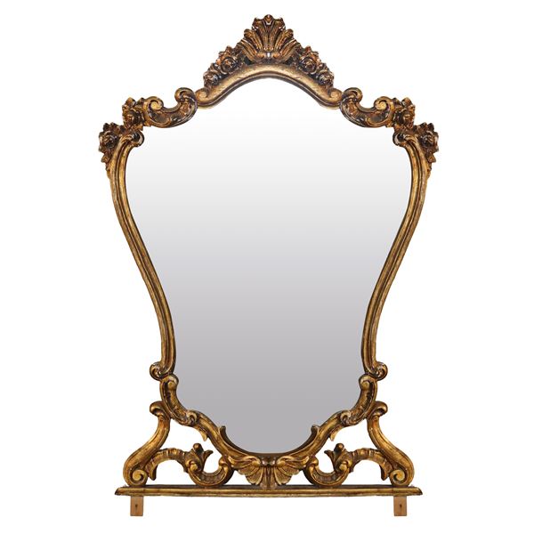 Specchiera in legno dorato. Presenti cadute di dorarura