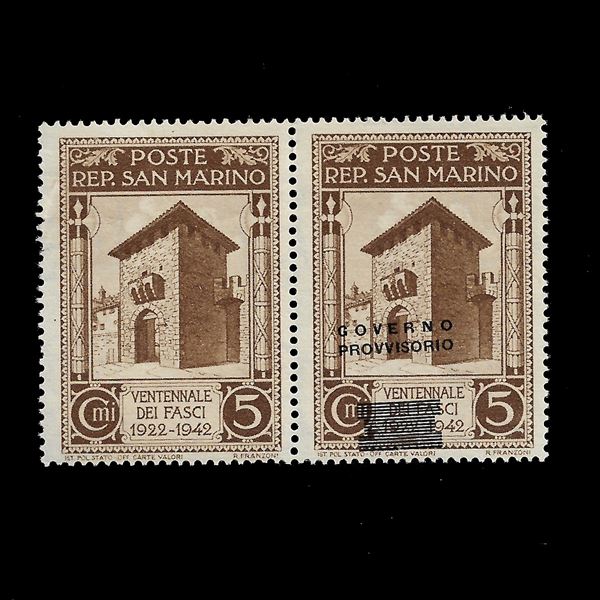 1943, horizontal pair of the 5th c. brown "Twenty Year of the Fasci" with overprint "Governo provisiono" (Sass. 266A) of which one without and one with oblique overprint inclined from bottom to top, new. Ray Gold Cert