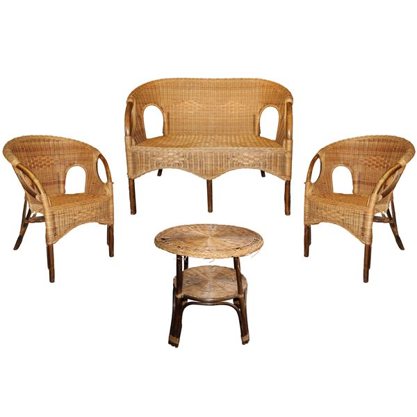 Garden lounge, in rattan and wicker composed of two armchairs, sofa and coffee table