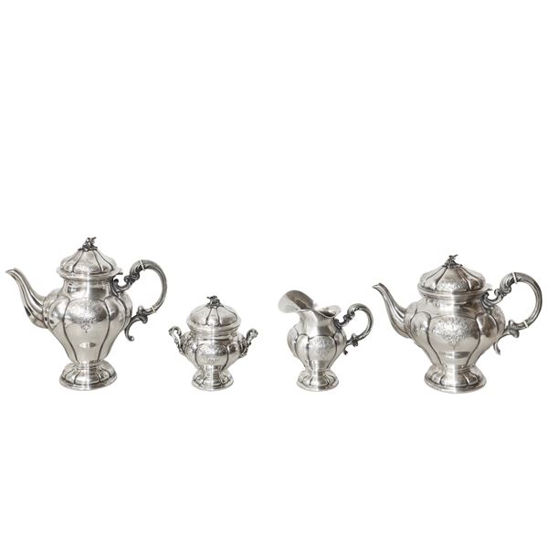 Silver service with embossed lobe decoration consisting of coffee pot, milk jug, sugar bowl and teapot