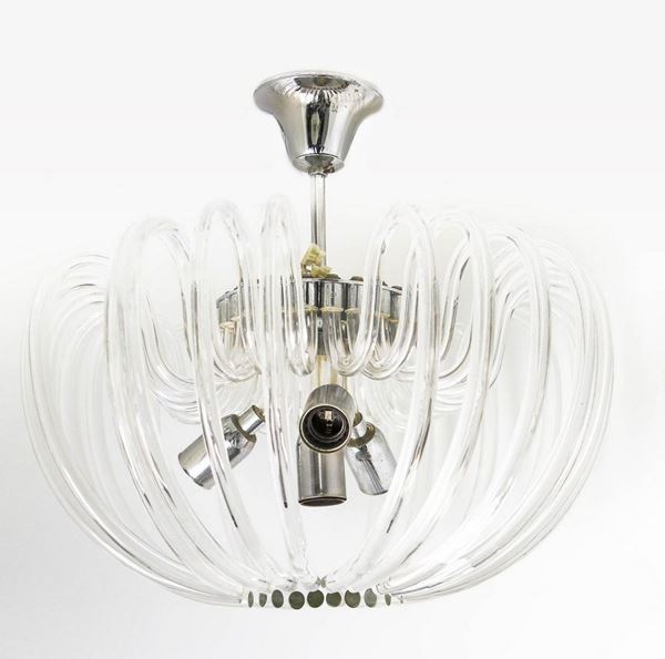 Bakalowicz & Sone, 70s. Murano glass chandelier with curved shape glass elements. Chromed metal structure.


H cm 30x40
