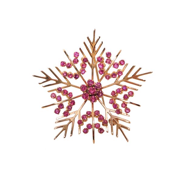 Brooch in yellow gold with rubies