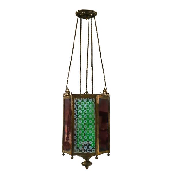 Rectangular lantern with polychrome glass and golden metal structure