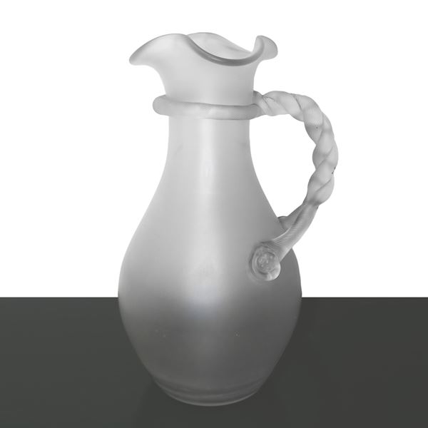 Jug in transparent satin glass, wavy everted neck, torchon handle applied like a jug, prod. Italian in the style of Salviani, 1930s