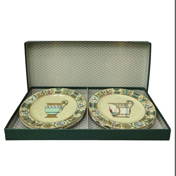 Gucci - Set di quattro piatti da parete in porcellana con decorazione multicolore e dorata